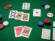 Overhead photo of a clean Texas Hold’em setup on green felt: A♥ K♥ as