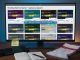 Evening desk scene with a monitor showing 10 anonymized sportsbook windows comparing odds for