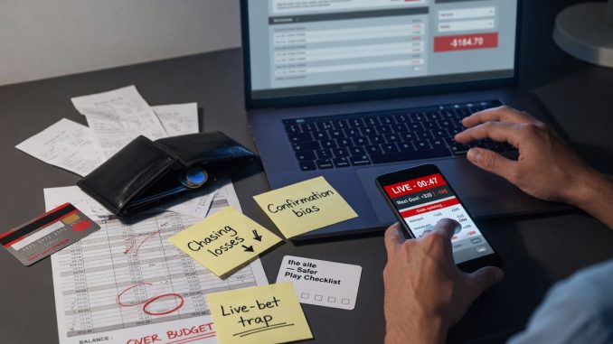 Photographic top-down flat lay on a dark desk: a laptop with a generic, logo-free