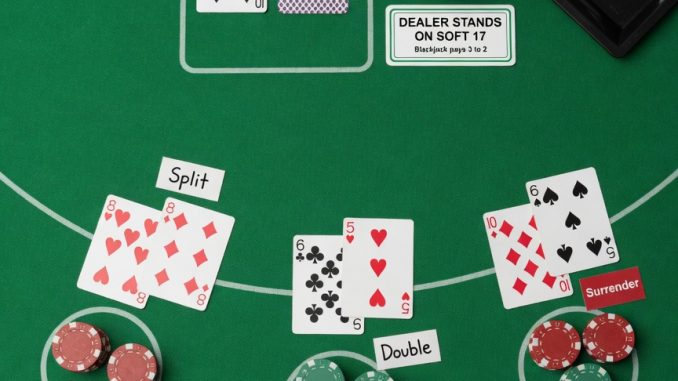 Photorealistic top-down photo for the site: a minimal blackjack teaching setup on clean green