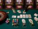 Top-down photographic still life on green felt summarizing casino games in a single, clean